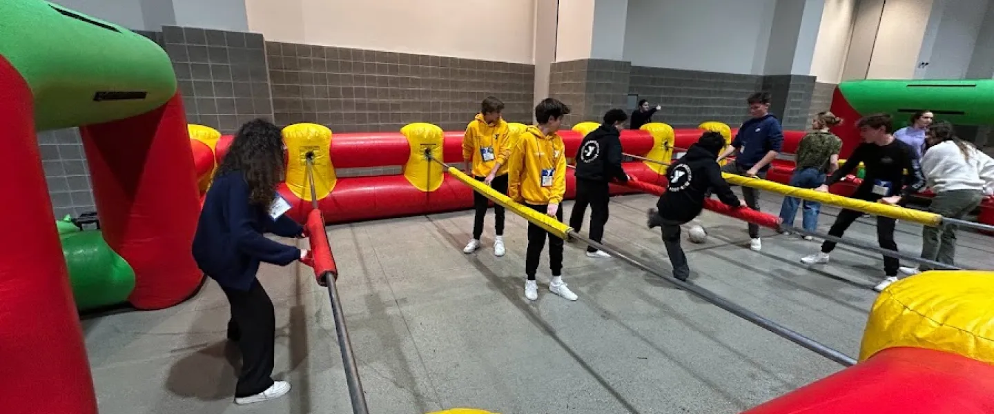 Kids playing human foosball