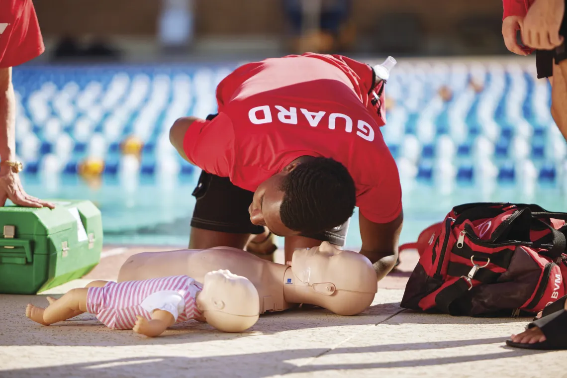 lifeguard practicing on dummy