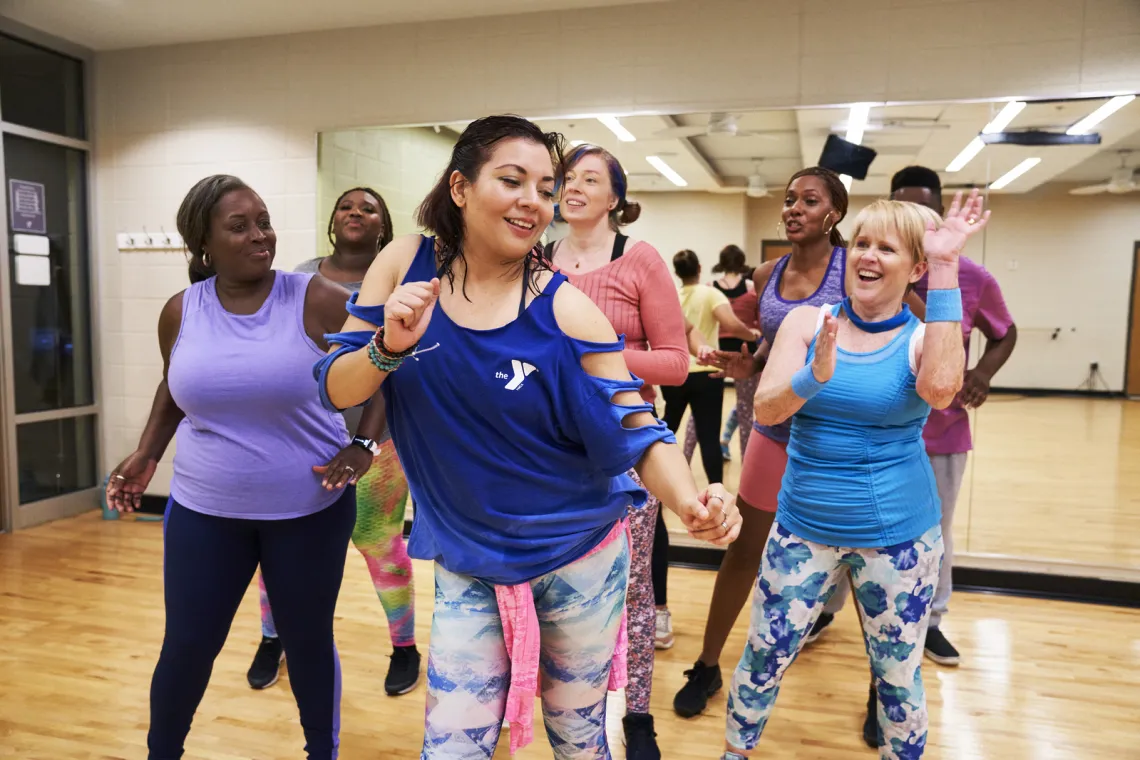 instructor dancing with participants