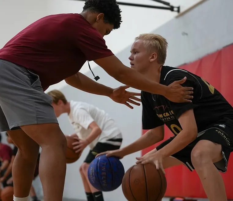 Coach training basketball player